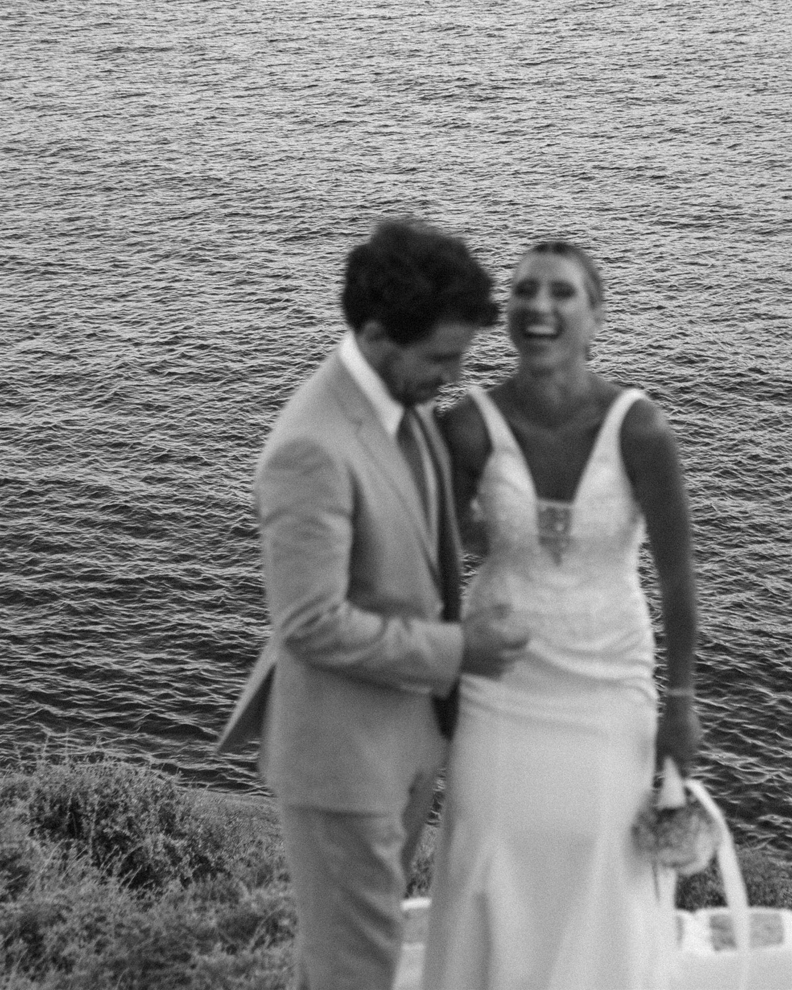 Close, quiet embrace between bride and groom