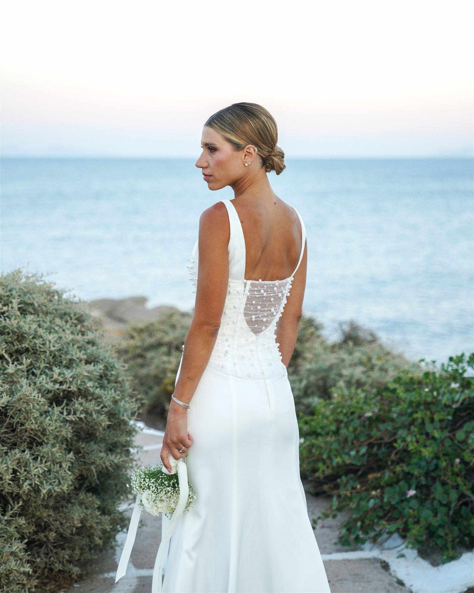 Bride looking out over the sea at blue hour on the Sifnos coast